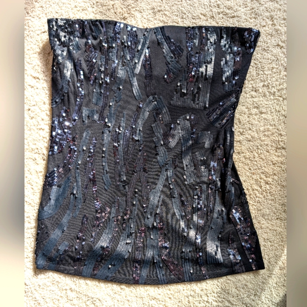 Strapless sequined top.
